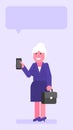 Old business woman three quarters face holding suitcase and mobile phone