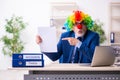 Old businessman clown working in the office Royalty Free Stock Photo