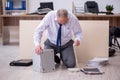 Old businessman employee in bankruptcy concept in the office Royalty Free Stock Photo