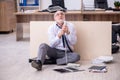 Old businessman employee in bankruptcy concept in the office Royalty Free Stock Photo