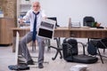 Old businessman employee in bankruptcy concept in the office Royalty Free Stock Photo