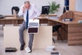 Old businessman employee in bankruptcy concept in the office Royalty Free Stock Photo