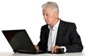 Old businessman with laptop isolated on white background Royalty Free Stock Photo