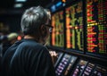 Old businessman looking at screen showing stock market conditions