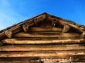 Old Cabin Roof Logs and Blue Sky