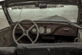 Old cabin of a rusty abandoned truck.