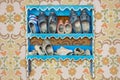Old cabinet with weathered vintage Dutch wooden clogs Royalty Free Stock Photo