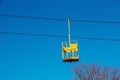 Old cable car in Dnepropetrovsk. Cable car cabins against the background of the blue sky and the urban landscape Royalty Free Stock Photo