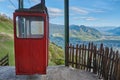 Old cableway in the mountains. Red vintage cableway in the Alps. Vintage gondola in the mountains