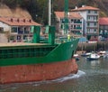 Old cabotage freighter entering Pasajes. Royalty Free Stock Photo