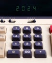 Old calculator showing a text on display - 2024