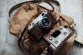 Old camera in bag, vintage photo grunge design component