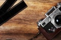 Old camera and blank film strip Royalty Free Stock Photo