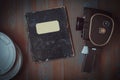 Old camera,boxes of film and a notebook Royalty Free Stock Photo