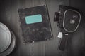 Old camera,boxes of film and a notebook Royalty Free Stock Photo