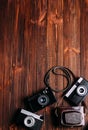 Old camera on a brown wooden background Royalty Free Stock Photo