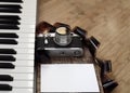 Old camera, film, piano Royalty Free Stock Photo