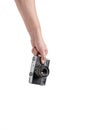 Old camera in hand isolated on white background. Royalty Free Stock Photo