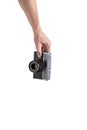 Old camera in hand isolated on white background. Royalty Free Stock Photo