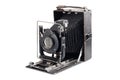 Old camera isolated on white background. Vintage photo camera in an open state Royalty Free Stock Photo