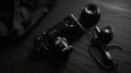 Old camera and lenses on a black background. Vintage style photo Ai generative Royalty Free Stock Photo