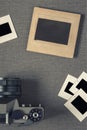 Old camera and negatives in paper frames Royalty Free Stock Photo
