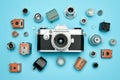 An old camera and other vintage cameras displayed together in a collection, Vintage camera and stickers with fails on a blue Royalty Free Stock Photo