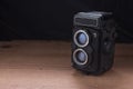 Old Camera Photo on a wooden surface Royalty Free Stock Photo