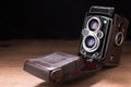 Old Camera Photo on a wooden surface Royalty Free Stock Photo