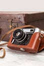 Old camera with retro case. Royalty Free Stock Photo