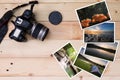 Old camera and stack of photos on vintage grunge wooden background