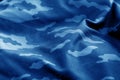 Old camouflage cloth with blur effect in navy blue tone