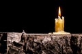 Old candle on the black background Royalty Free Stock Photo