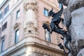 Old Candle Holder in the Shape of a Dragon Hanged on the Corner of a Building in the Street in the Center of Rome Royalty Free Stock Photo