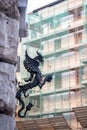 Old Candle Holder in the Shape of a Dragon Hanged on the Corner of a Building in the Street in the Center of Rome Royalty Free Stock Photo