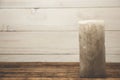 Old candle stands on a wooden table