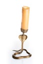 Old candlestick with a burning candle isolated Royalty Free Stock Photo