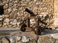 An old cannon against a stone wall at the fortress in Travnik