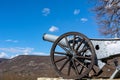 Old cannon aimed in the sky on hill in nature