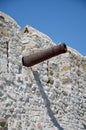 Old cannon barrel on defensive wall