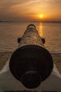 Old cannon at beautiful sunset