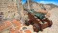 Old cannon in Castillo San Felipe de Barajas with the Convent of La Popa in the background