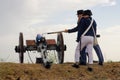 Old cannon firing, artillery soldiers