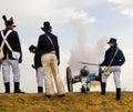 Old cannon firing, artillery soldiers