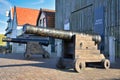 Old cannon in front of sea archaeology Museum `Kaap Skil` on island Texel