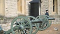 Old cannons at entrance to Museum. Action. Old small artillery cannons with wooden wheels stand at entrance to