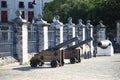 Old cannons by the fence on a sunny day. Havana Royalty Free Stock Photo