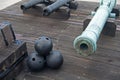 Old canons and cannonballs in a fort