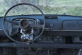 Old car abandoned, dashboard and steering wheel Royalty Free Stock Photo