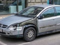 Old car after an accident. Dismantled wing, damaged mirror and front door Royalty Free Stock Photo